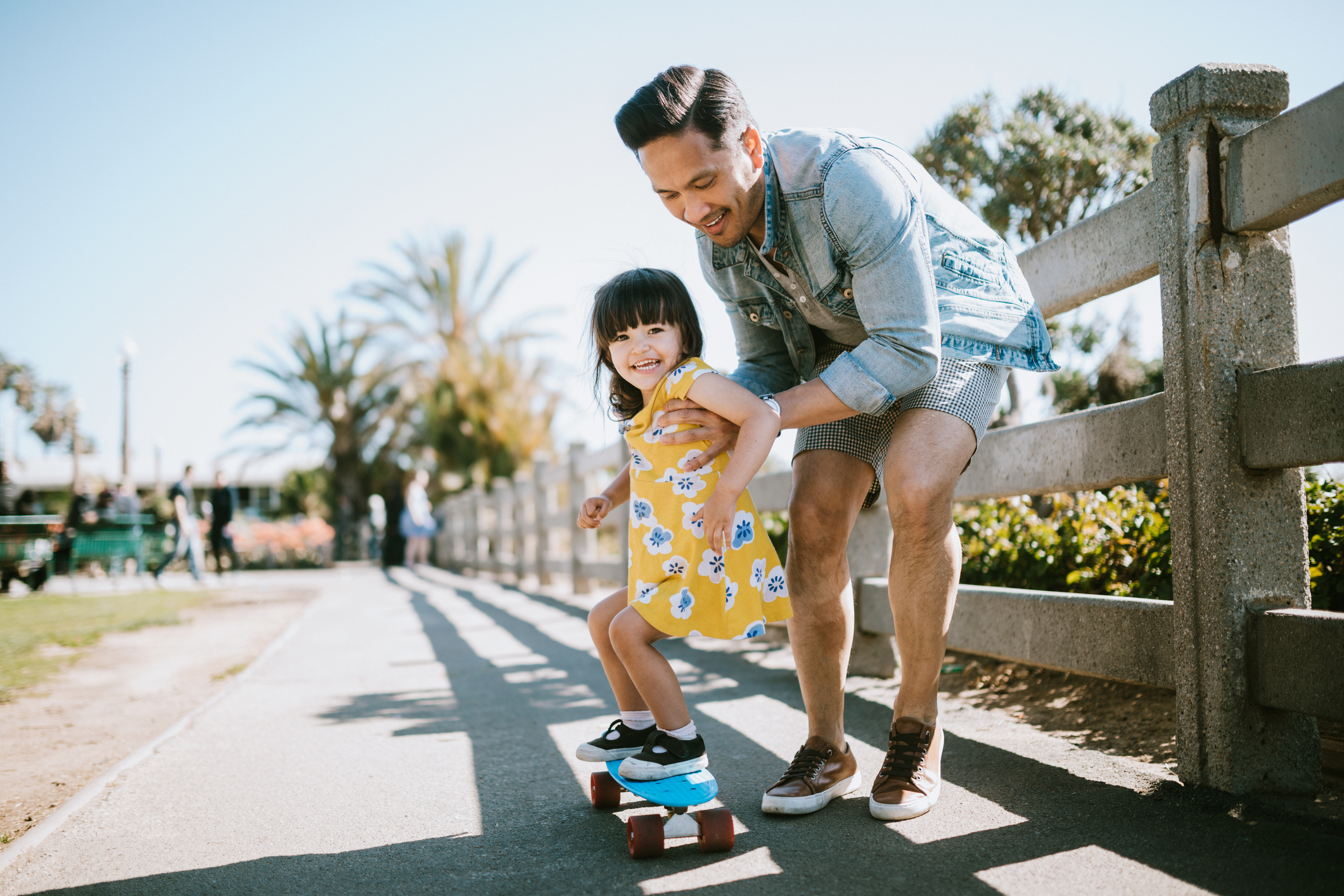 1266364224 Father Teaching Daughter To Skateboard