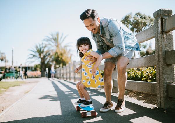 1266364224 Father Teaching Daughter To Skateboard